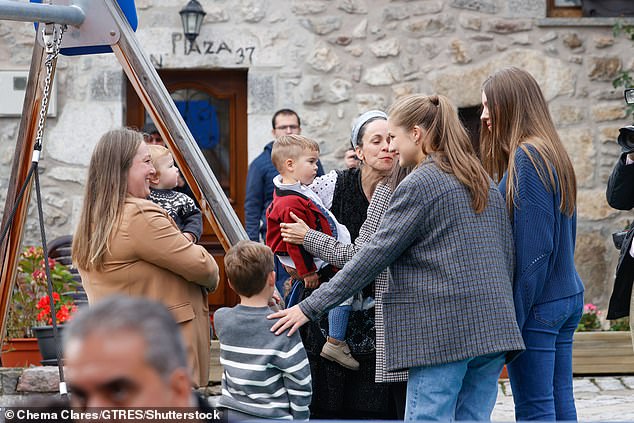 Princesses Leonor and Sofia stopped to talk to families who had gathered to greet them