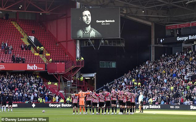 All those present observed a minute's silence in honor of Baldock on Saturday afternoon