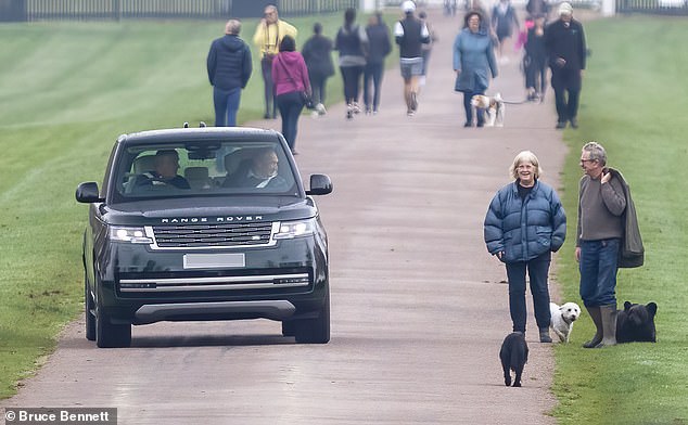 The Duke of York, 64, drove through the grounds of Windsor Castle on Saturday, stopping briefly on the Long Walk to smile at the crowd through his car window