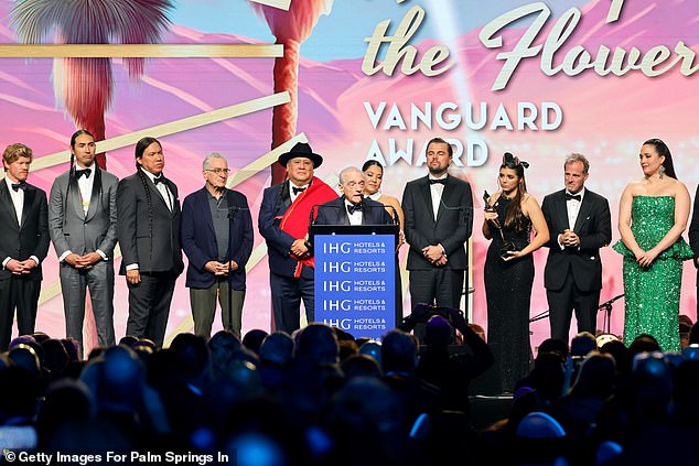 From left to right: Jesse Plemons, Tatanka Means, William Belleau, Robert De Niro, Yancey Red Corn, Martin Scorsese, Leonardo DiCaprio, Lulu Goodfox, Bradley Thomas, Lily Gladstone and Talee Redcorn accept the Vanguard Award for Killers of the Flower Moon reception at the Vanguard Awards on January 4 in Palm Springs, California