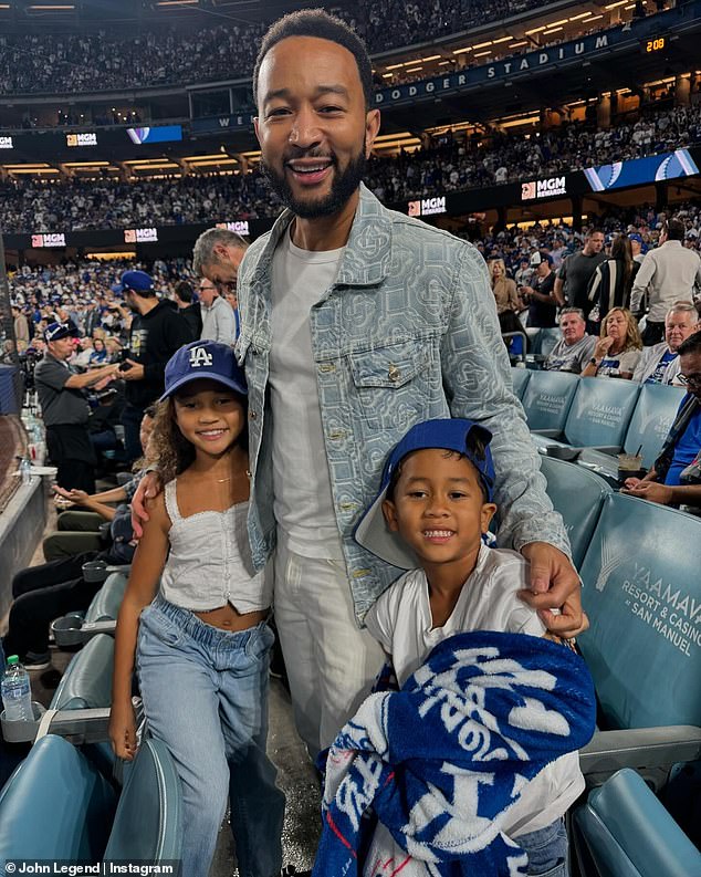 He had stopped for a few memorable photos with children Luna, eight, and Miles, six, as the trio watched the Los Angeles Dodgers beat the New York Yankees at Dodgers Stadium.