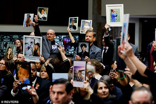 Families held up photos of victims of child exploitation and suicide in the audience behind the five tech bosses during the arraignment hearing.