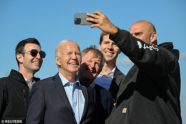 Senator John Fetterman (right) takes a selfie with (from left) Senator Chris Deluzio, President Joe Biden, Pennsylvania Senate Democratic Leader Jay Costa and former Representative Conor Lamb as Biden arrived at Pittsburgh International Airport on Saturday