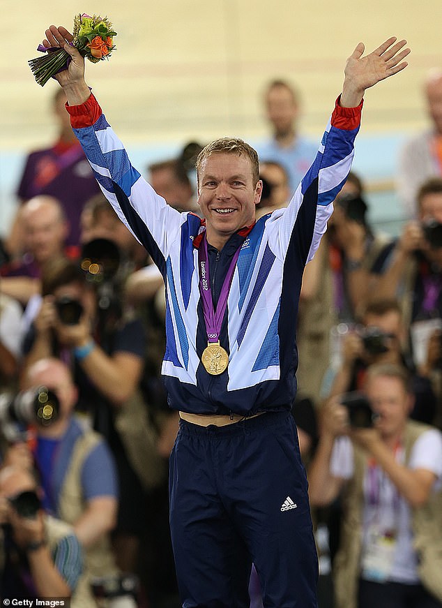 Sir Chris Hoy celebrates on the podium after winning a gold medal at London 2012