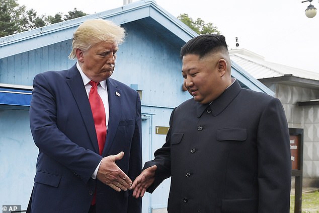 North Korean leader Kim Jong Un (right) and then US President Donald Trump prepare to shake hands in the border village of Panmunjom in the Demilitarized Zone, South Korea, in June 2019