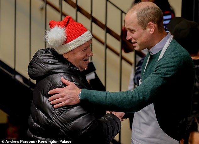 Another look at Prince William as he volunteers his time at the Passage in Kensington