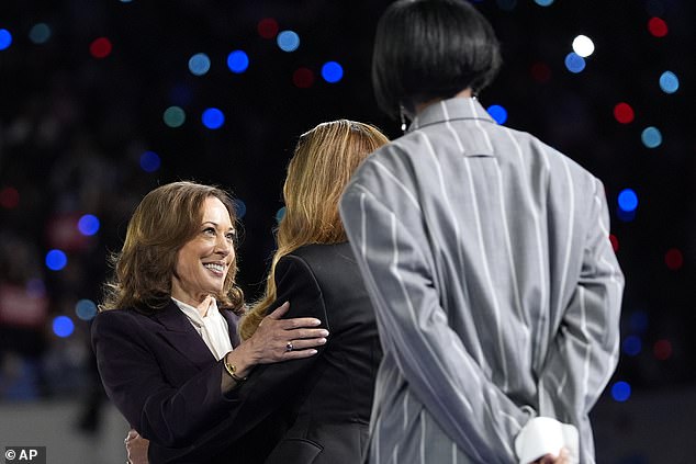 The vice president greets Beyoncé after taking the stage in Houston