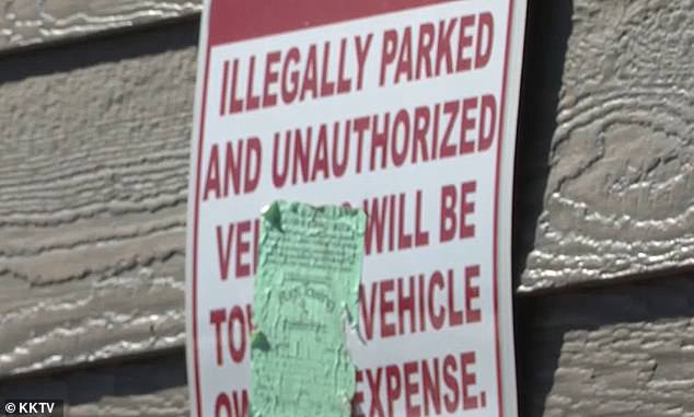 The owners of the complex have placed a sign in front of their building warning motorists that the spots in the alley are private parking