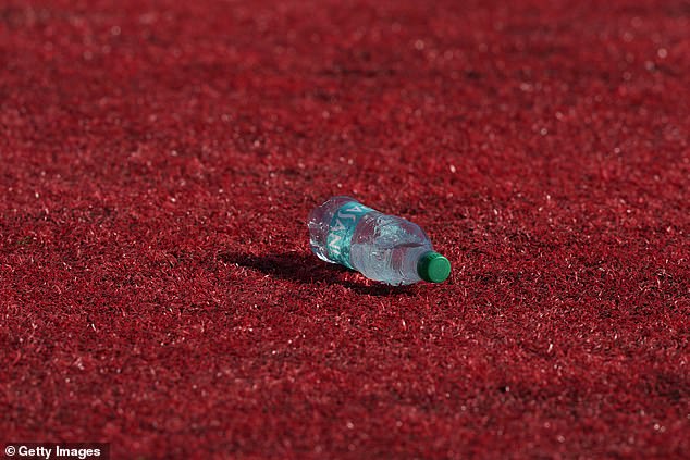 Fans also threw plastic water bottles onto the field, briefly halting the match