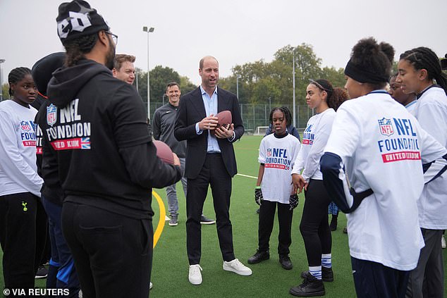 William from the NFL Foundation, wearing a slim-fit blazer, shirt and chinos, with a pair of nice white sneakers