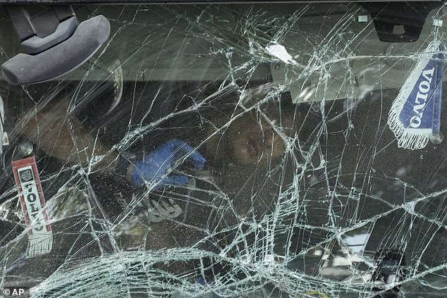 An Israeli police officer inspects the cabin of a truck that rammed into a bus stop near the headquarters of Israel's Mossad spy agency, injuring dozens of people, Israeli rescue service Magen David Adom near Tel Aviv, Israel, said.