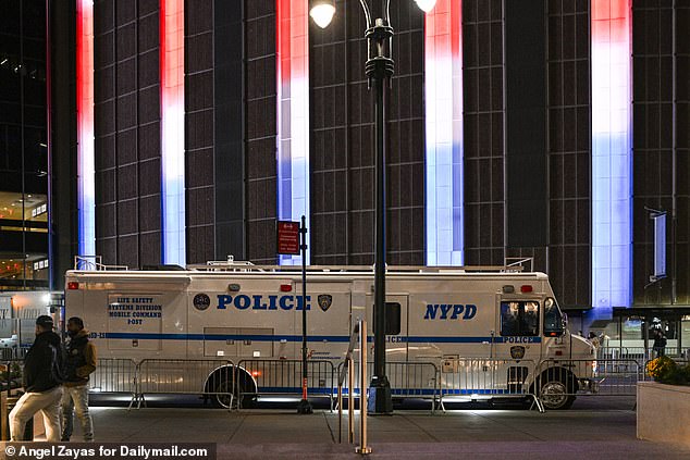 Red, white and blue lights illuminated the streets outside MSG as NYPD officers and vehicles arrived