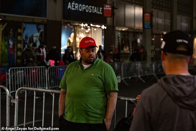 Although New York is a decidedly blue state, the Big Apple is still Trump's original birthplace and where the billionaire started his business empire decades ago. (photo: a MAGA supporter waiting in line)