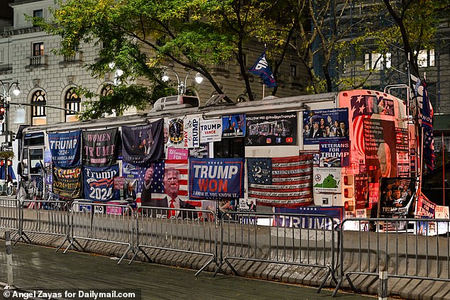 Just outside the arena, a trailer is seen covered in Trump flags