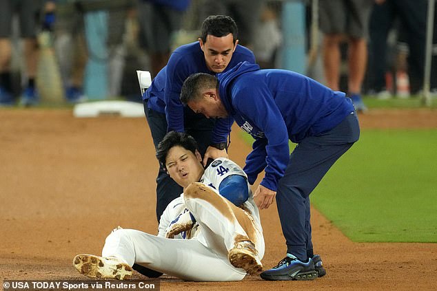 Ohtani reacts after suffering a shoulder injury against the New York Yankees in the seventh inning