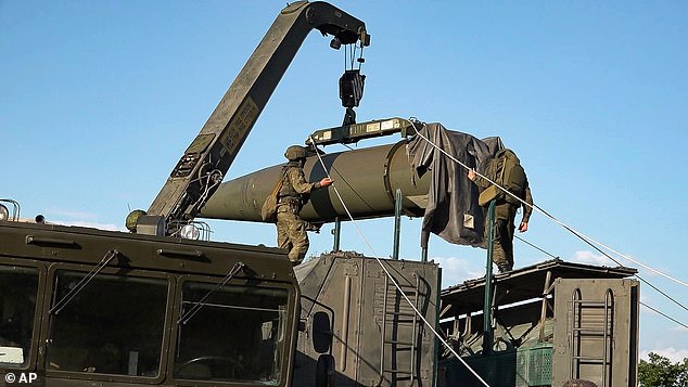 Russian troops load an Iskander missile as part of exercises to train the military in the use of tactical nuclear weapons at an undisclosed location in Russia