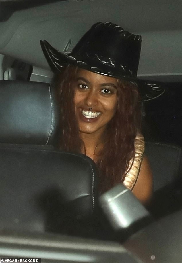 Malia smiled as she sat in the back of a car on her way to The Birds Street Club in West Hollywood