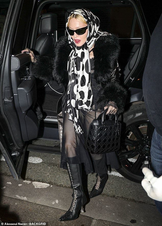 The Material Girl singer kept warm under the long jacket with a beautiful fur collar and matching cuffed sleeves