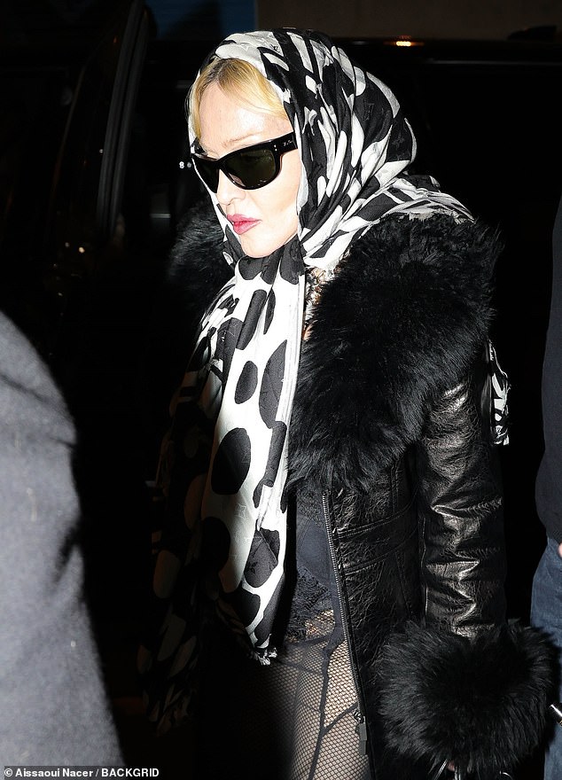 She kept a low profile with a headscarf and sunglasses