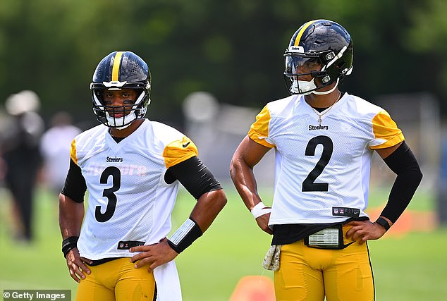 Russell Wilson #3 looks on with Justin Fields #2 of the Pittsburgh Steelers during the Pittsburgh Steelers OTA offseason training at the UPMC Rooney Sports Complex