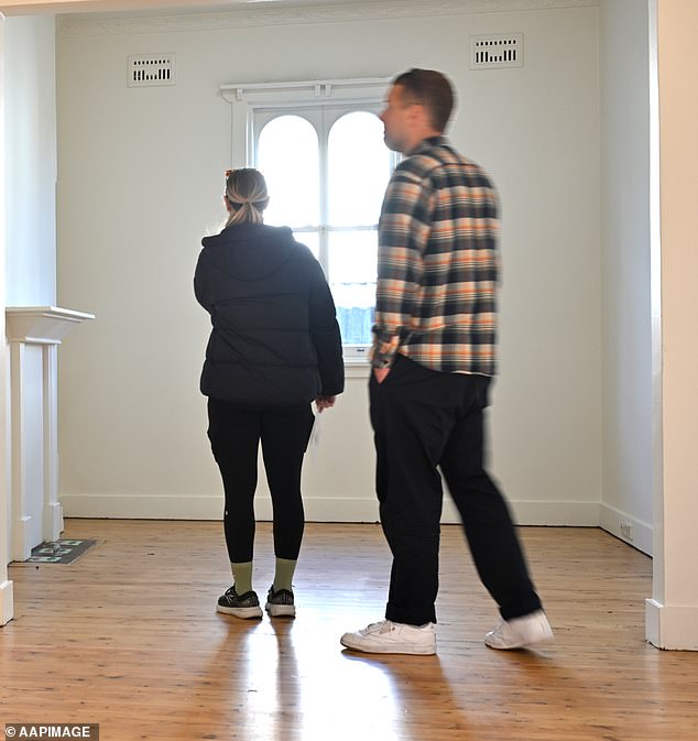 Mr Jahan said to ensure an agent is genuine, potential buyers can ask for proof of the higher offer if the property is a private treaty (photo of buyers inspecting a Sydney property in August)