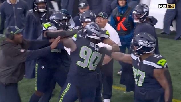 The two Seahawks teammates had to be separated as tensions ran high during the loss