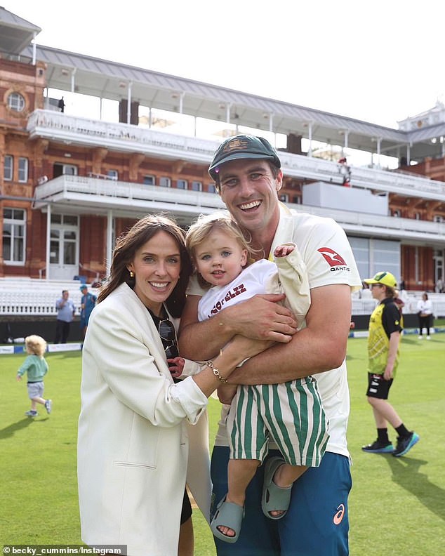 Cummins (pictured with wife Becky and their son Albie) came under fire after reports that players were unhappy with Langer's intense coaching style