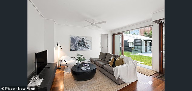 The New Farm property opens up completely, allowing fresh air and sunlight into most rooms, including the downstairs living room overlooking the pool