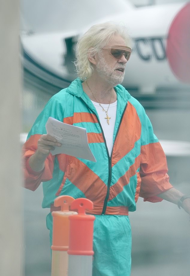 That's right, it's Bob Geldof! He looked very different from his normal appearance as he cut a vibrant figure in a bright orange and blue shell suit as he channeled '90s fashion