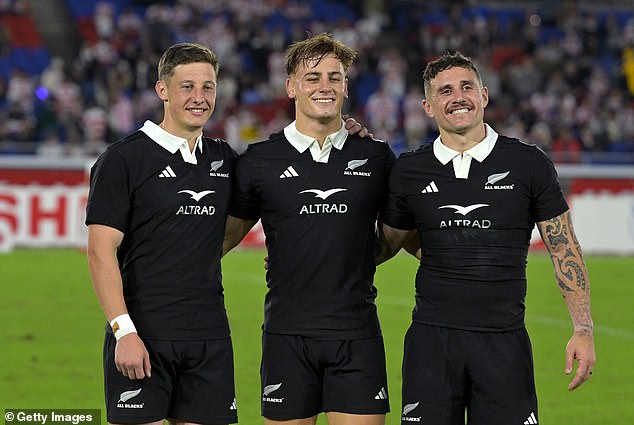 Love (pictured center with All Blacks teammates after the win over Japan) says he used his teacher's doubts as fuel to drive him for years