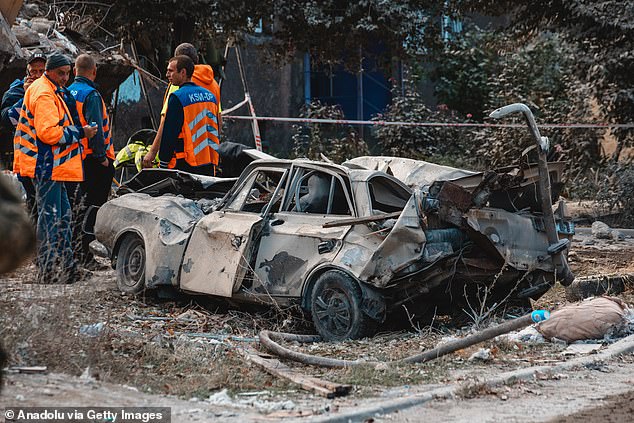 A view of the damaged vehicles after a Russian missile attack on a residential building that killed 5 people and injured 21 in Dnipro, Ukraine on October 26, 2024