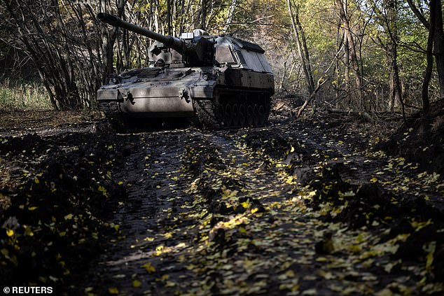 A Ukrainian military member of the 43rd Hetman Taras Triasylo Separate Artillery Brigade pilots a Panzerhaubitze 2000 self-propelled howitzer, amid the Russian attack on Ukraine, at a position in the Donetsk region, Ukraine, October 26, 2024