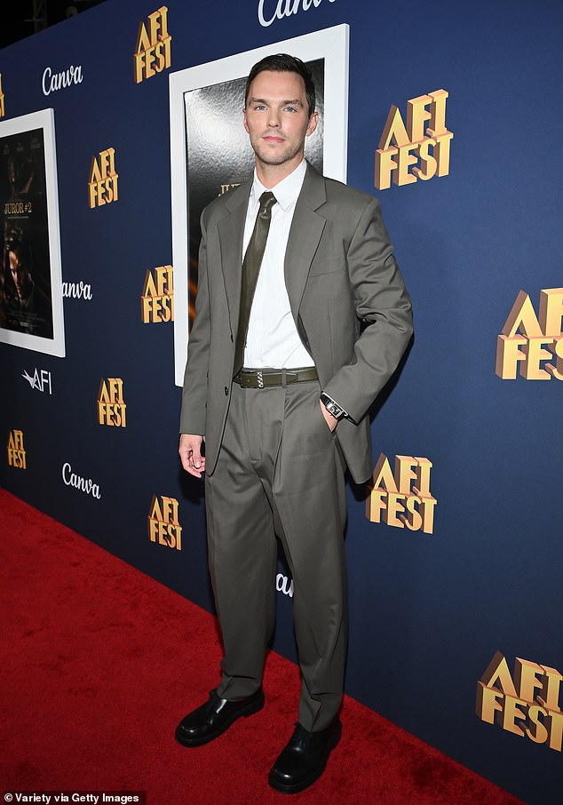 To complete his look, Nicholas wore a brown leather tie, a brown belt and a pair of chunky black lace-up shoes