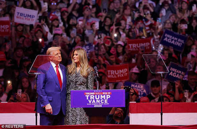 Donald Trump hugs Melania Trump during a rally at Madison Square Garden