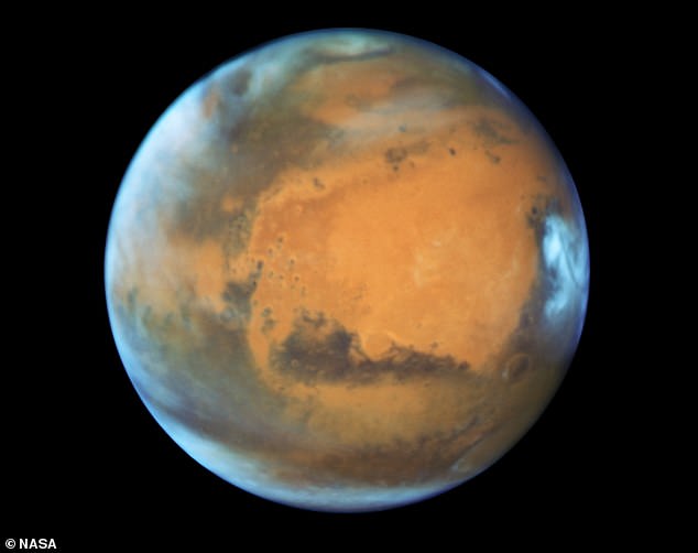 Mars is the fourth planet from the sun - a dusty, cold desert world with a thin atmosphere. In the photo, Mars was captured by the Hubble telescope