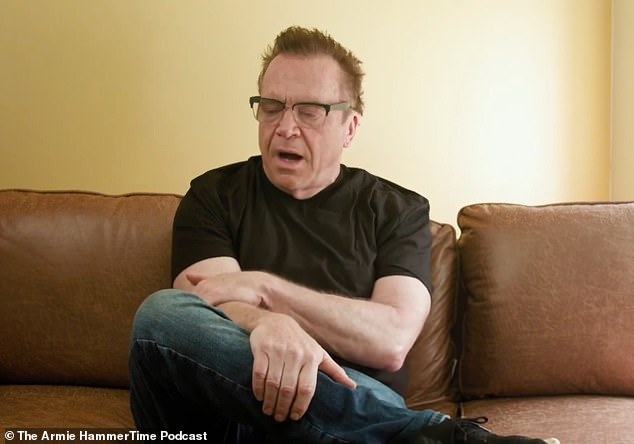 Tom Arnold was sitting on a used leather lounge sofa that Hammer had found on Facebook Marketplace