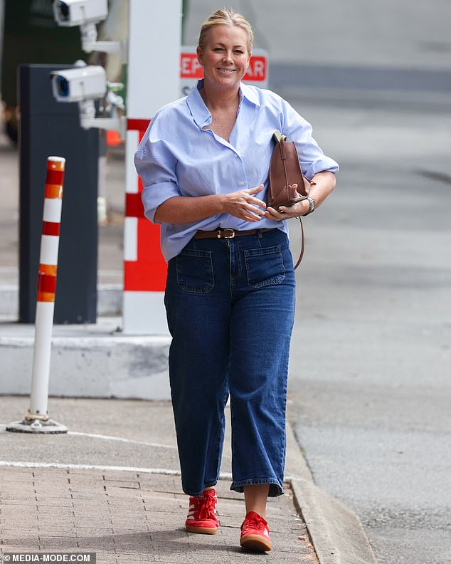 Sam, 48, looked cheerful as she left the network complex, dressed from head to ankle in Channel Nine blue