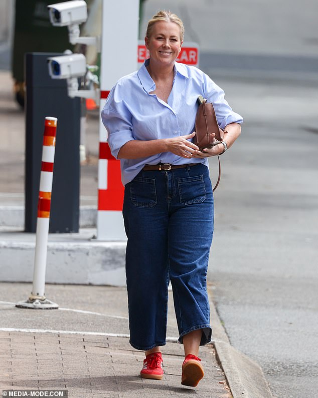 She completed her ensemble with a pair of red Adidas sambas to add a touch of street style to her look