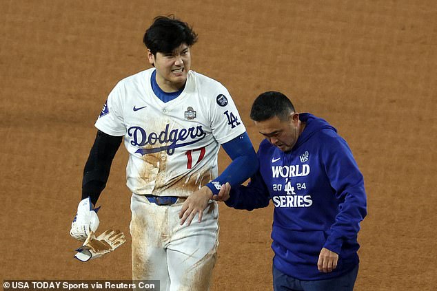 Ohtani walks off the field after suffering a shoulder injury against the New York Yankees