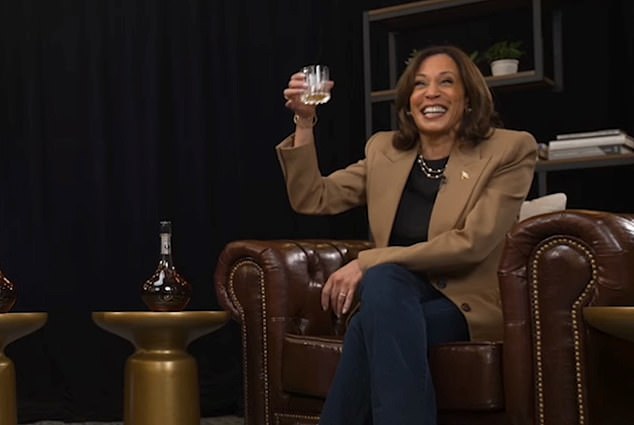 Democratic presidential candidate, US Vice President Kamala Harris, raises a toast with former NFL star Shannon Sharpe