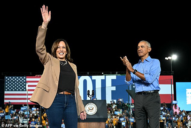 Former US President Barack Obama cheers on US Vice President and Democratic presidential candidate Kamala Harris during a campaign rally at James R Hallford Stadium in Clarkston, Georgia