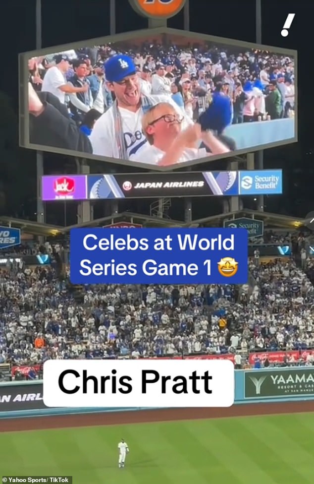 While on screen, the father-son duo, who wore matching Dodgers jerseys and baseball caps, stood up and waved enthusiastically at the camera.