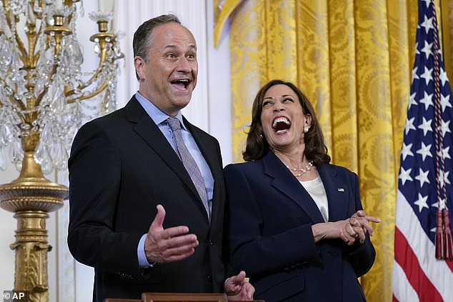 Vice President Kamala Harris (right) laughs as her husband Doug Emhoff (center) responds to a question from first lady Jill Biden while speaking during an event celebrating Pride Month in the East Room of the White House, Wednesday, June 15 2022