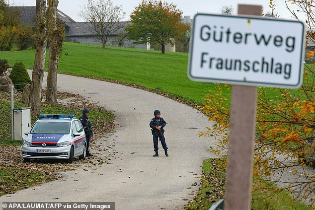 Police officers patrol Altenfelden, Upper Austria, on October 28, 2024, after at least two men were shot dead in the morning in the Mühlviertel region