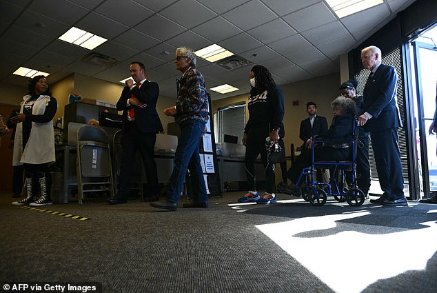 The commander-in-chief looked like a regular citizen as he stood in line with his Secret Service agents and greeted a woman in a wheelchair.