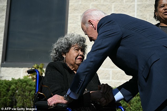 Biden greets a woman outside a polling place in New Castle, Delaware, on Monday before casting his vote in the presidential election