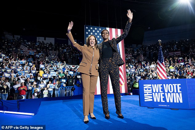 Vice President and Democratic presidential candidate Kamala Harris and former First Lady Michelle Obama campaign together at the Wings Event Center in Kalamazoo, Michigan, October 26, 2024