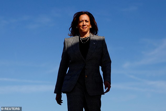 Vice President Kamala Harris walks aboard Air Force Two to depart for Michigan on Monday