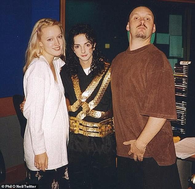 'I had no idea what to do. She was a cute 19-year-old with a dark bob and a great body, but she only liked women,” Tony continued. 'Phil was very excited but Christie kept hitting him away. She did her thing and then left.” Jackie id pictured with Phil (r) and Michael Jackson tribute act Jason Jackson