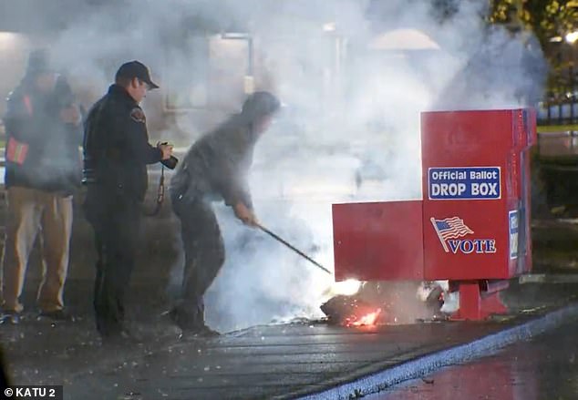 Authorities working to extinguish a fire at a polling place in Vancouver, WA, began early Monday morning. It was one of two fires set early Monday at two polling places in two separate states